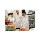 Permalink to Food-service assistant training will benefit people with disabilities Three people in a kitchen setting are preparing food. One person peels carrots while the others observe. They are all wearing white chef uniforms. In the background are kitchen shelves with various equipment. A box of carrots is on the counter.